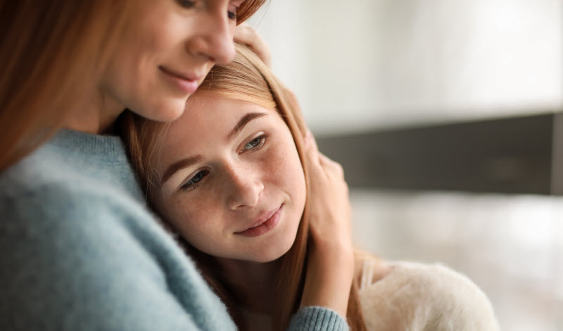 Cairns Paediatric Psychology - Caring to grieving child Mother comforting daughter