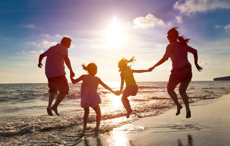 Cairns Paediatric Psychology - Childs first role model Happy family jumping at the shore