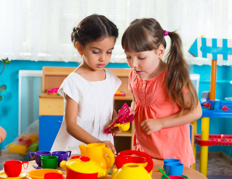 Cairns Paediatric Psychology - Social Skills Two cute little girls playing role game in daycare