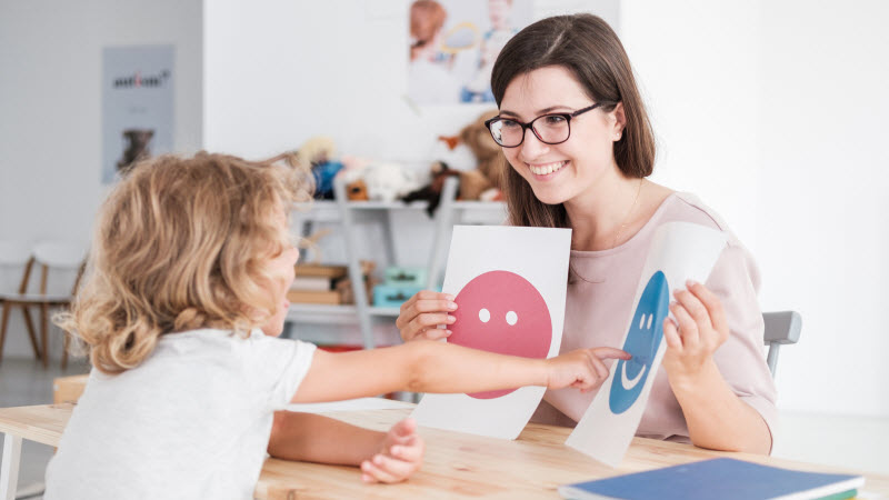 Cairns Paediatric Psychology - Verbal instructions for ADHD Happy teacher doing activity with a student