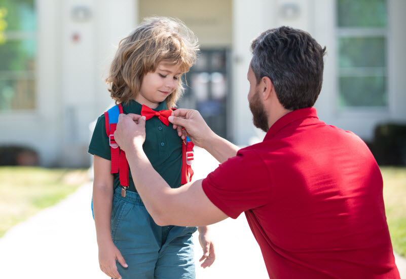 Cairns Paediatric Psychology - What parents can do Father fixing son's bow while dropping to the school